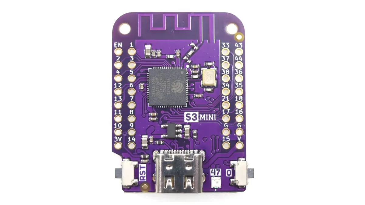A LOLIN S3 Mini board: purple PCB with an ESP32-S3 chip, two rows of labelled pins and a USB-C port.